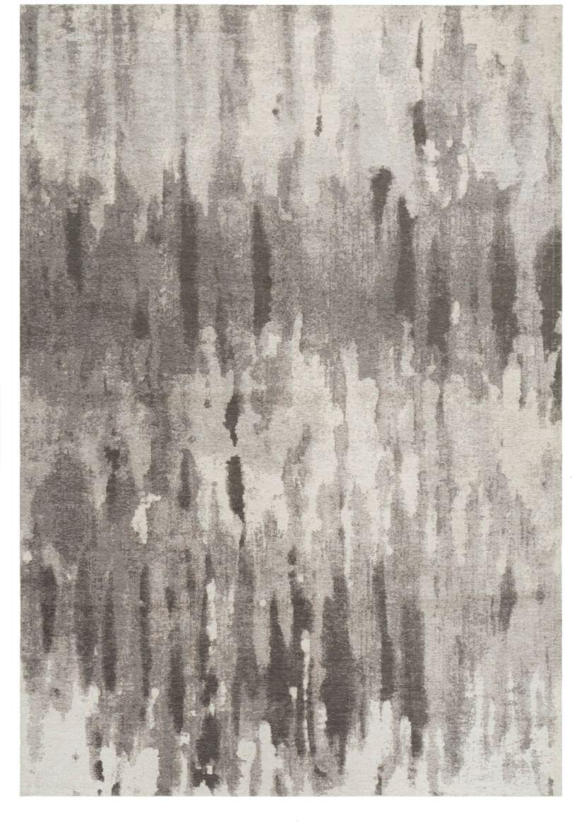 Nowoczesny dywan Canvas Warm Gray z abstrakcyjnym wzorem w pionowe pasy w odcieniach szarości i bieli.